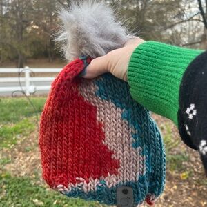 Hand knit beanie with faux fur pom pom